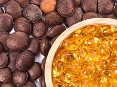 Yellow Gelatine Capsules In Wooden Bowl Coffee Beans Around